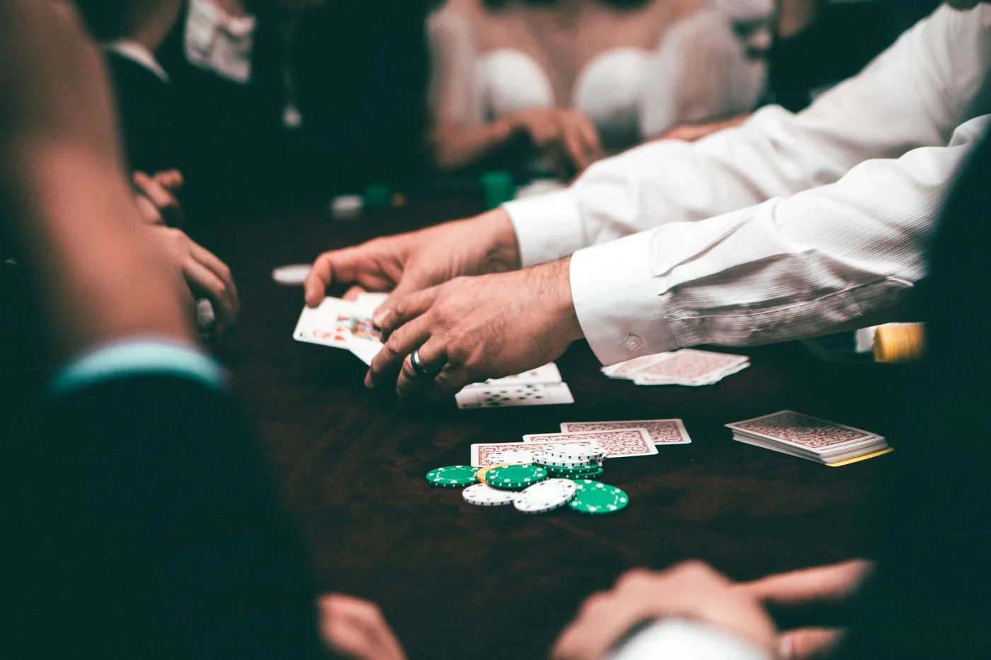 Branded playing cards arranged on a corporate poker table