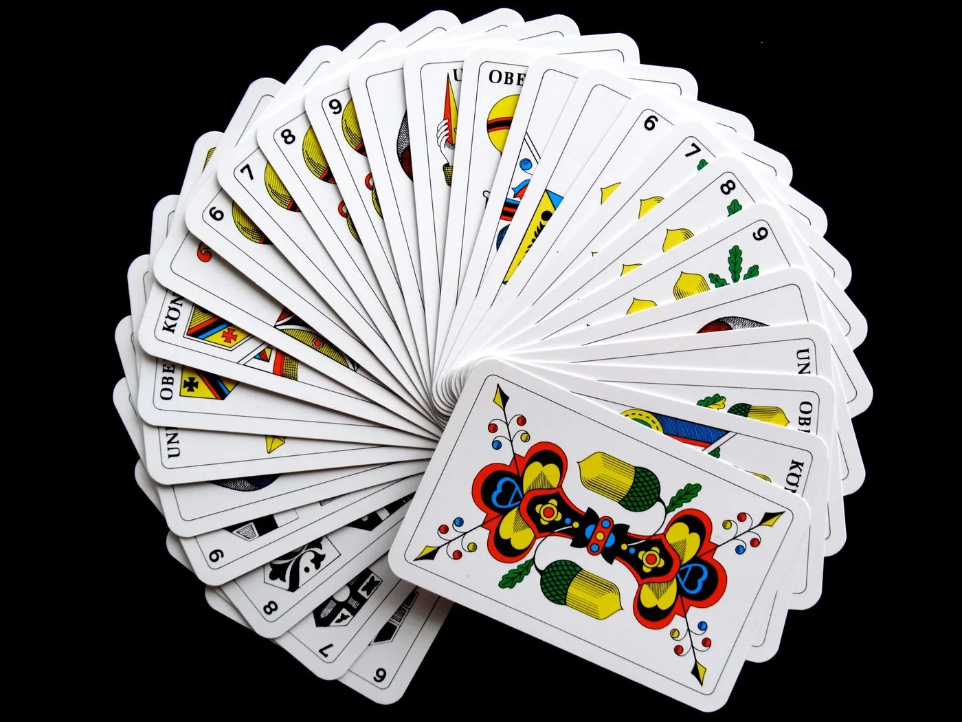 Close-up of finished custom playing cards for surface and edge inspection