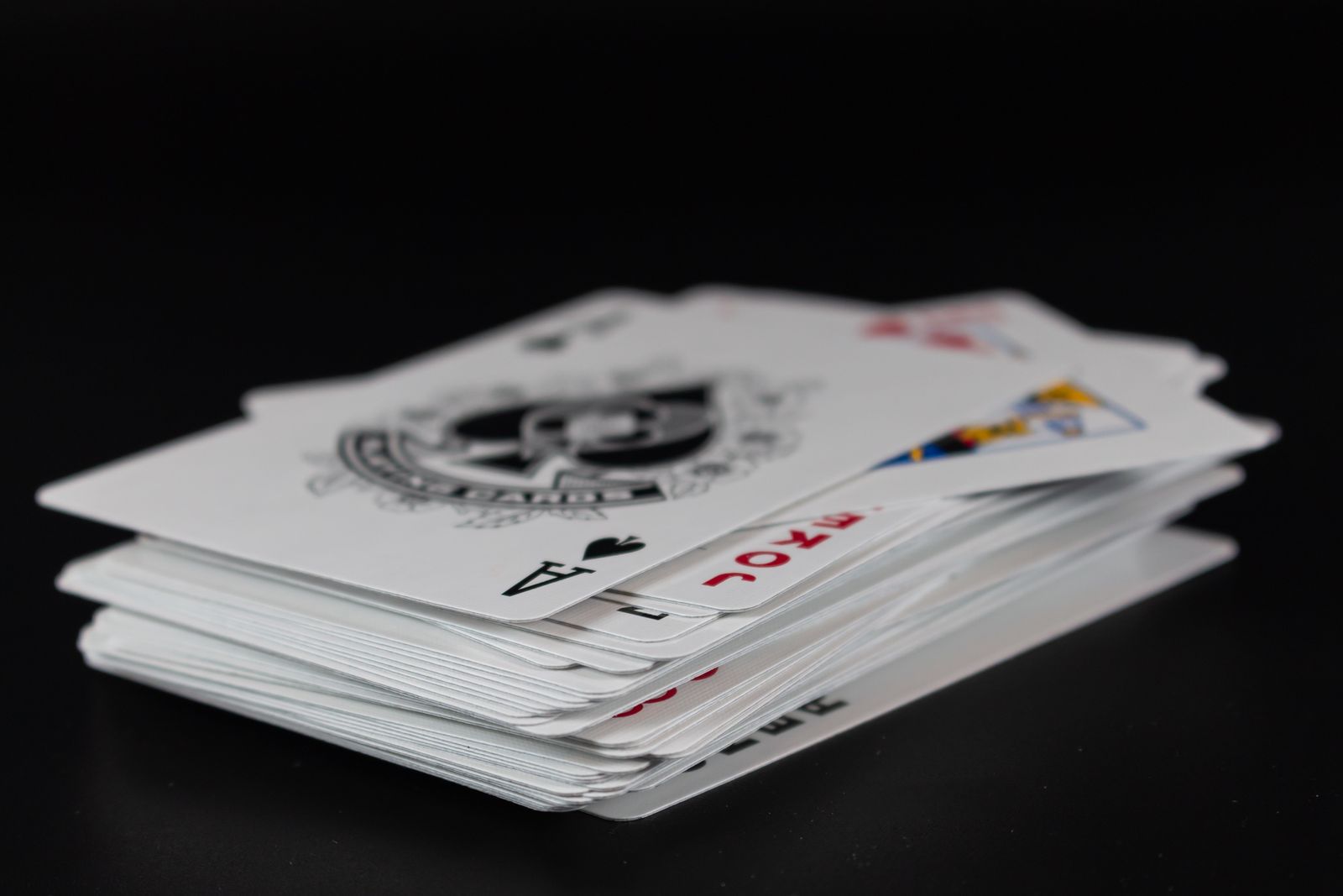 Black core playing card stock and edge detail for premium deck printing