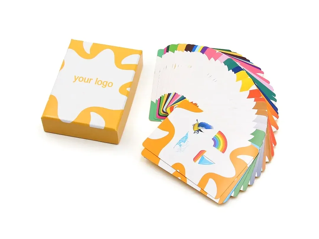 Custom learning card deck fanned beside a printed tuck box