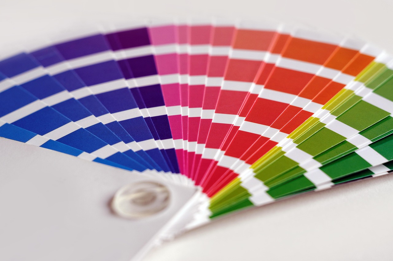 Printed colour reference fan arranged on a white tabletop